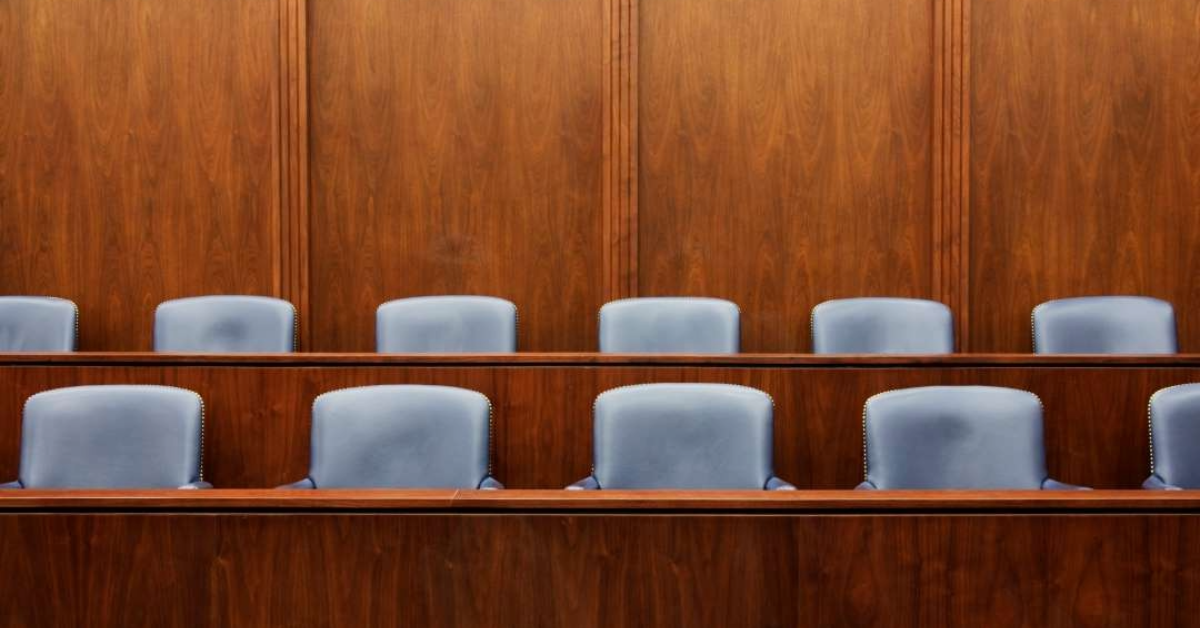 Featured image of empty courtroom jury seats