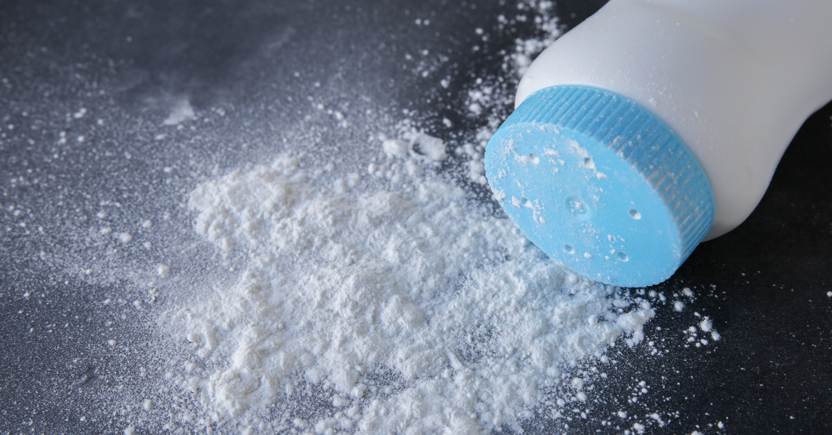 Featured image of a spilled bottle of baby powder on a black background