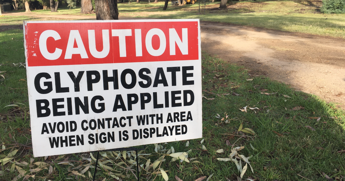 Sign reading "Caution: Glyphosate being applied"